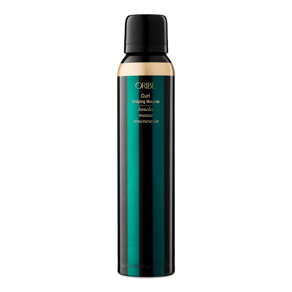 Emerald green aluminum can containing Oribe curl shaping mousse for hair.